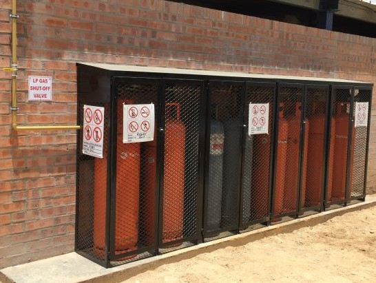 Ten gas bottles in cage